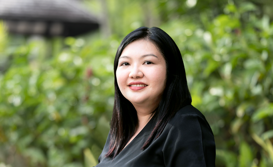 Professional portrait of a woman representing Entrust Network's IT managed services in Singapore.